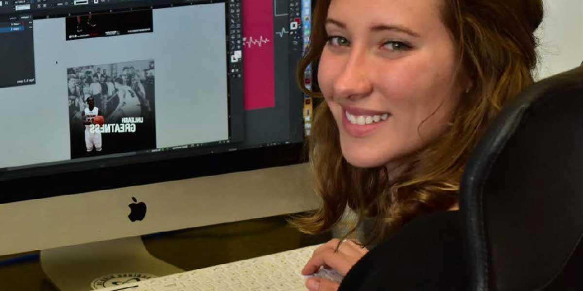 A student works on design projects at a computer.